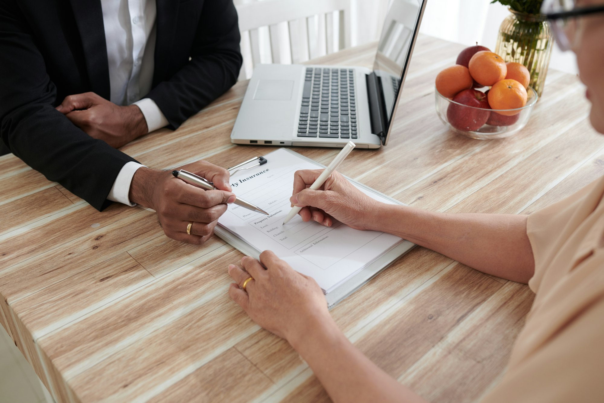 Senior Woman Signing Claim Form